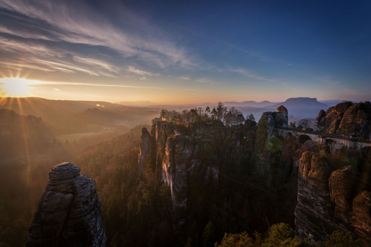 Scenic view of rock cliffs at sunrise