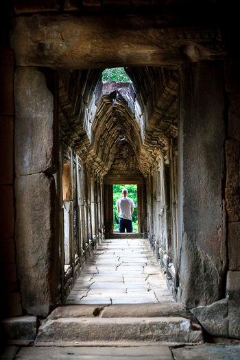 Woman walking in tunnel