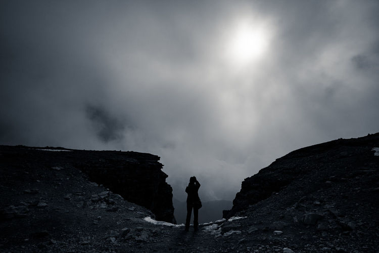 Woman standing against sky