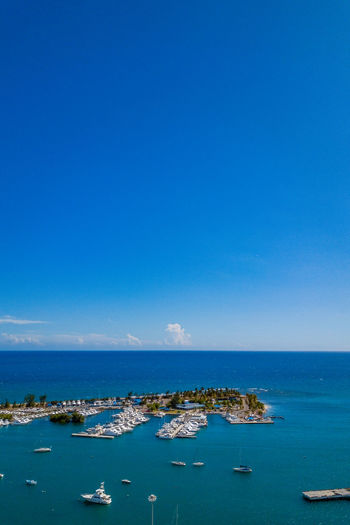 Scenic view of sea against clear blue sky