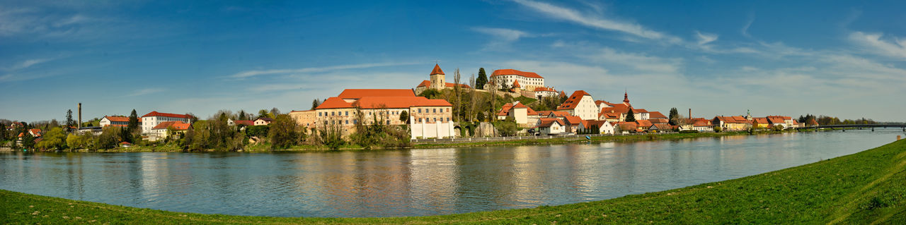 Panoramic view of buildings and houses against sky