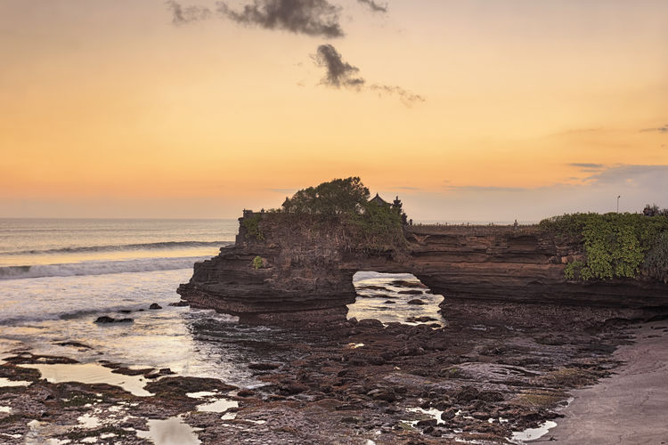 Scenic view of sea against sky at sunset