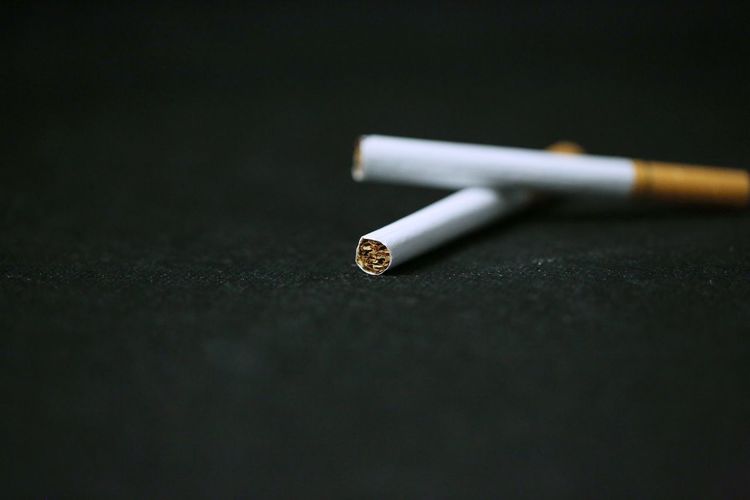 Close-up of cigarettes on table