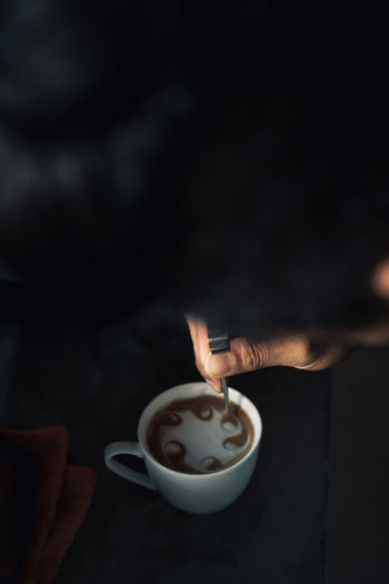 Cropped image of person with coffee cup