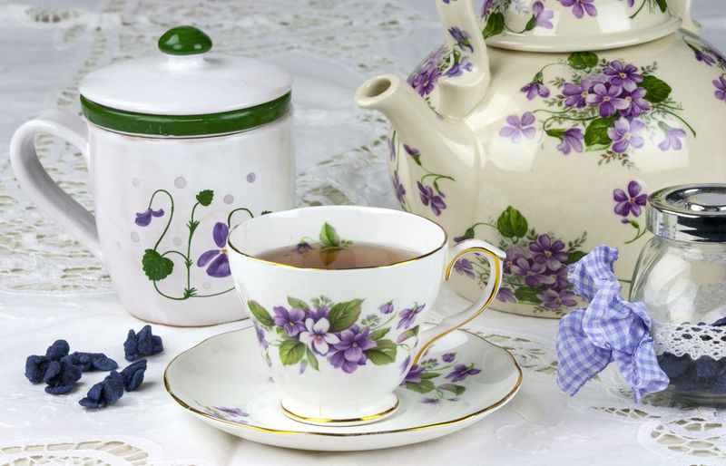 Elegant tea cup with purple floral pattern