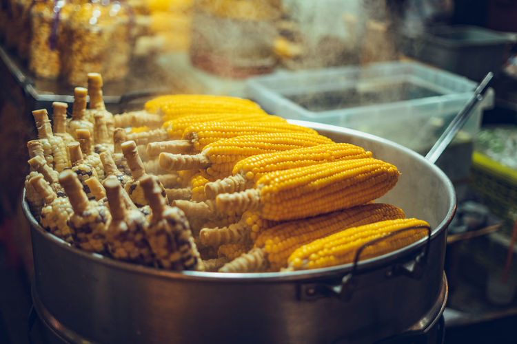 Close-up of corns in container