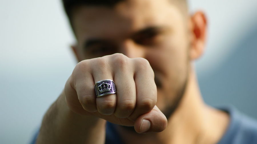 Close-up of man hand wearing finger ring