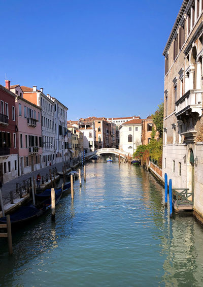 Venetian canal and old brick houses in venice, italy