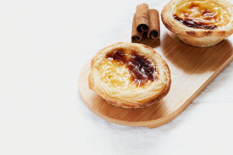 Pasteis de nata typical portuguese dessert. white background and selective focus. pastry concept