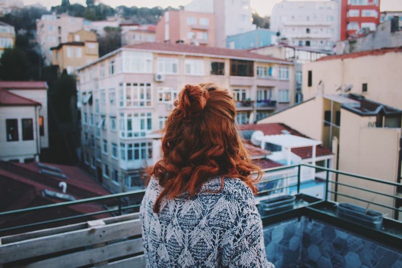 Cityscape Redhead Long Hair Young Adult Young Women Human Hair Rear View City Women One Person Building Exterior One Young Woman Only Adult Curly Hair Outdoors People Only Women Day Adults Only Fresh On Market 2017