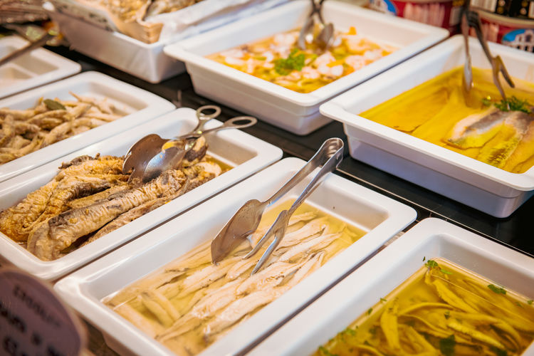 Large number of prepared seafood and fish variation display for sale in deli shop