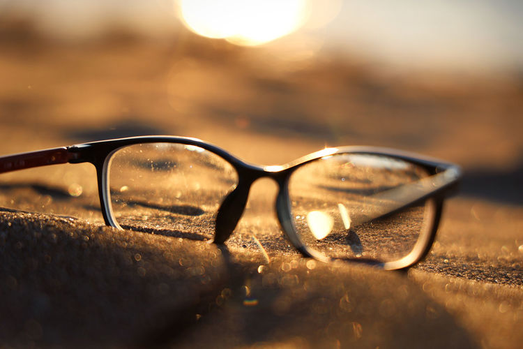 Close-up of sunglasses on glass
