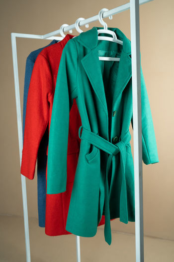 Coat of different colors on a hanger