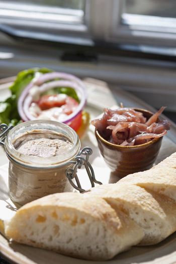 Plate with pate, chutney and baguette at restaurant