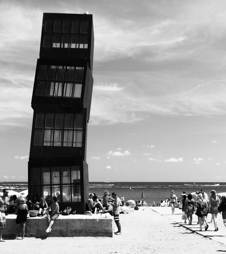 People at beach against sky barceloneta