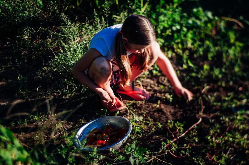 Girl planting in garden