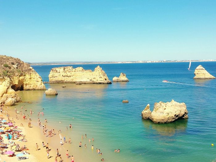 Scenic view of sea against clear blue sky
