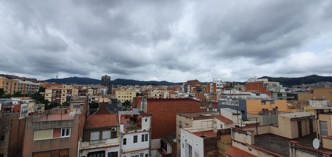 Panoramic view of residential buildings against sky