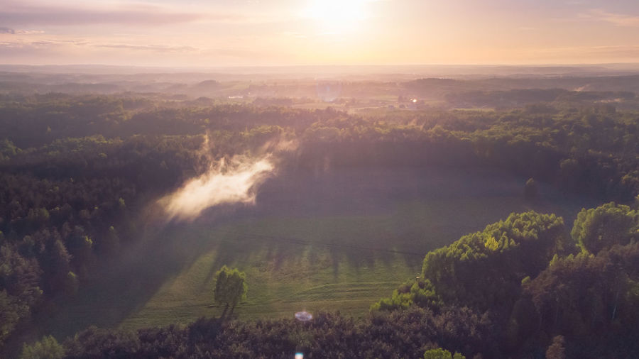 Aerial view of landscape against sky during sunset