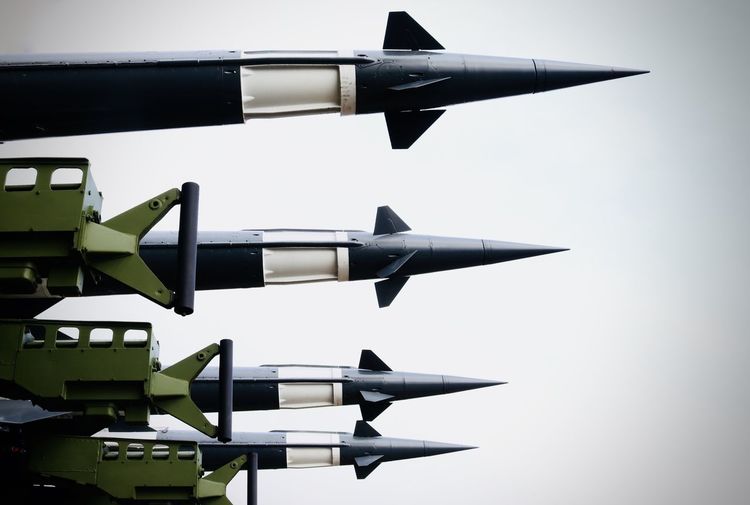 Low angle view of military rockets against sky