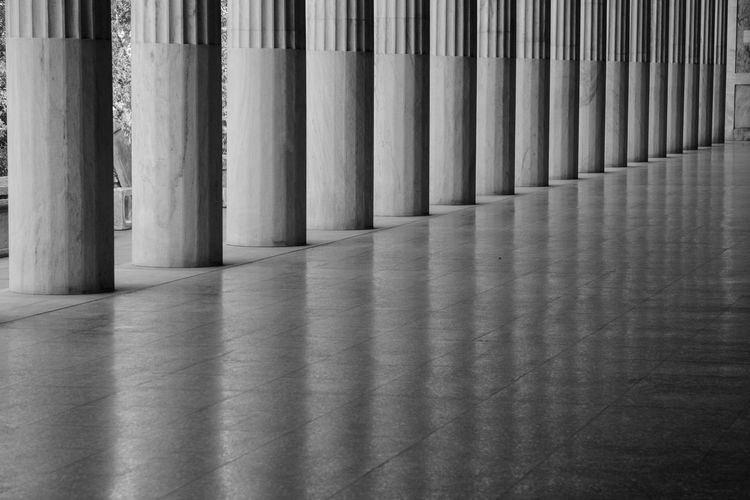 Greek columns reflected in a shiny floor in athens 