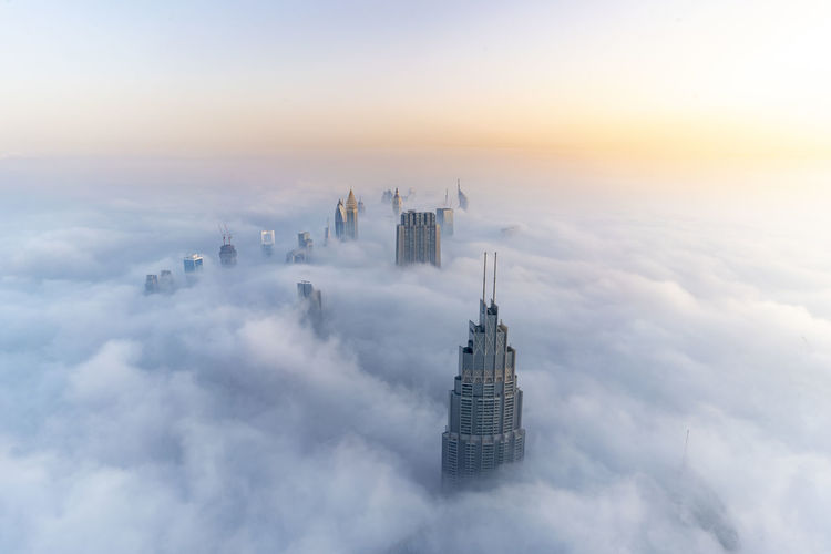 Aerial view of burj khalifa against cloudy sky