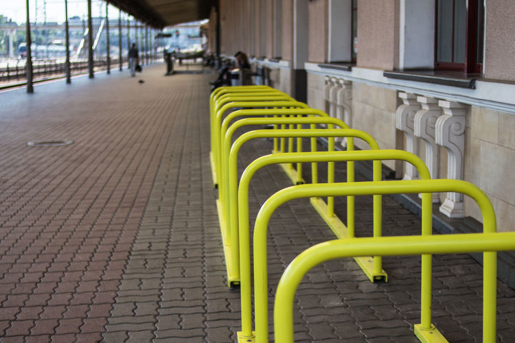 Empty chairs on street in city