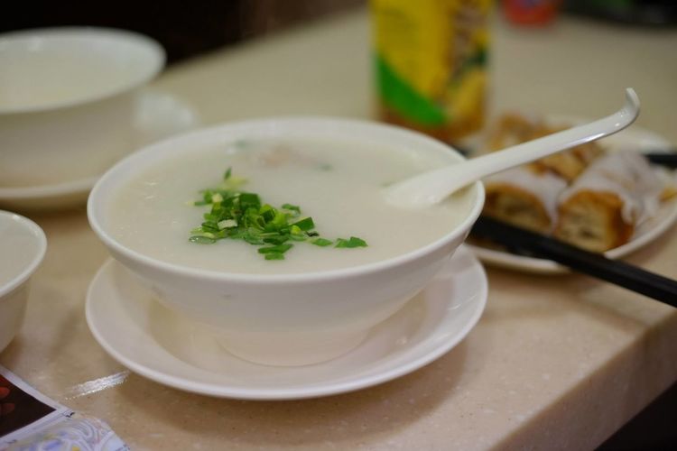 Close-up of congee served on table