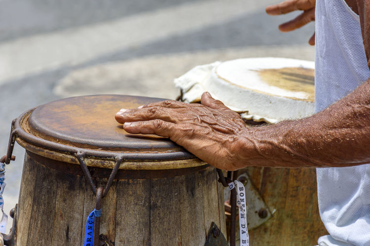 Brazilian percussion player instrument during a performance on pelourinho, salvador, bahia