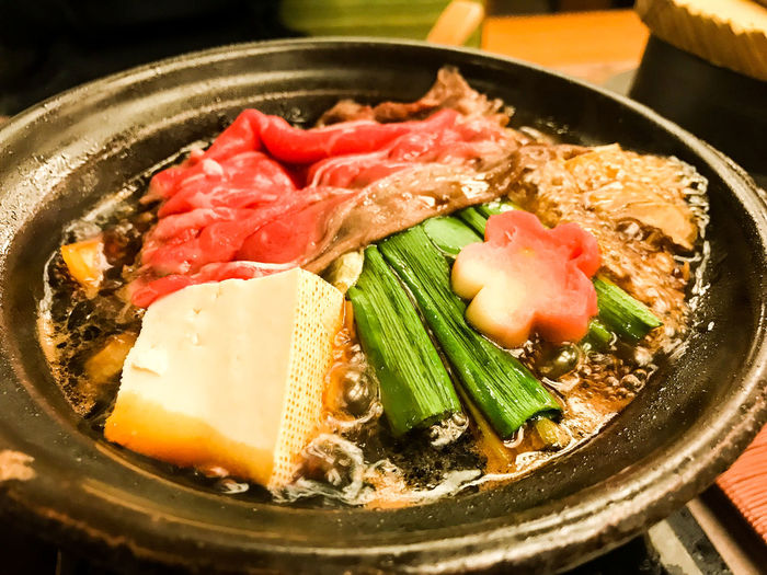 High angle view of sukiyaki in bowl on table