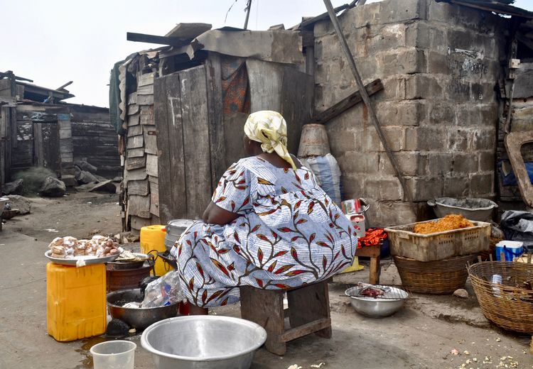 Woman selling food at slum