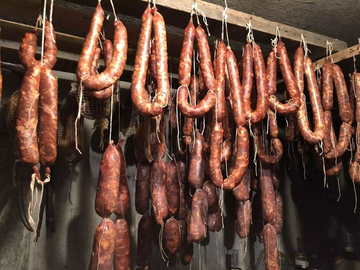Meat hanging on barbecue grill