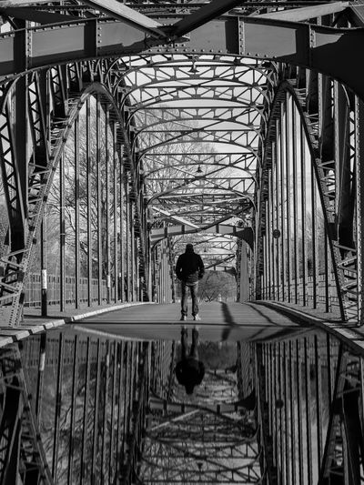 Man on footbridge
