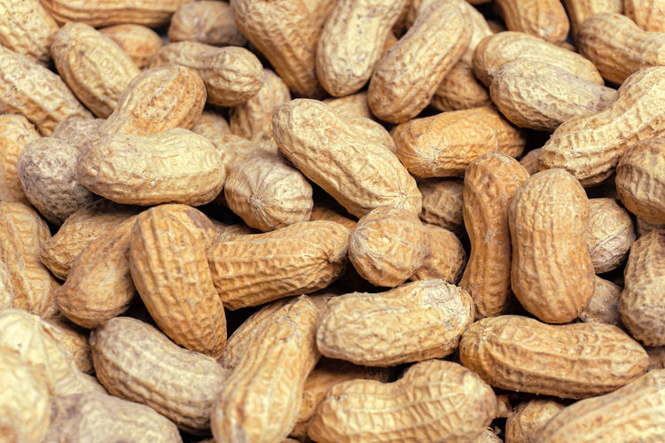 Close-up of a heap of peanuts. healthy peanuts. healthy eating. full frame shot of whole peanuts.