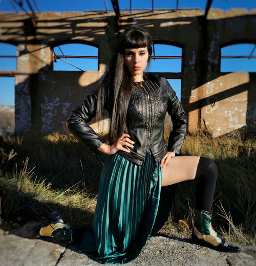 Portrait of young woman standing outdoors