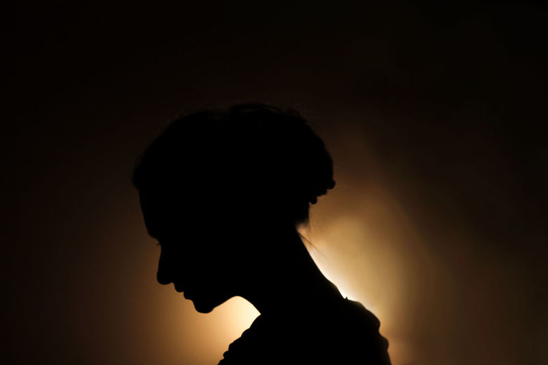 Silhouette of man against sky at sunset