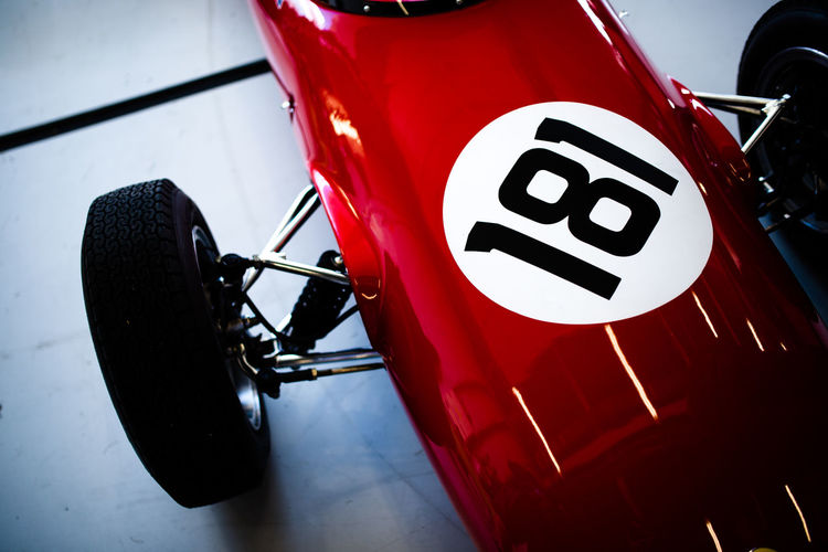 High angle view of brand new formula one red color sports car