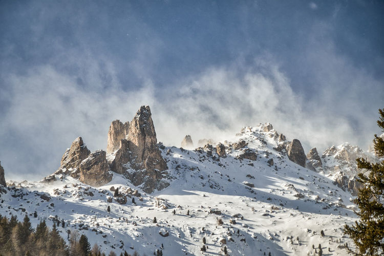 A stormy snowstorm over the italian dolomite summit with its typical rock formations