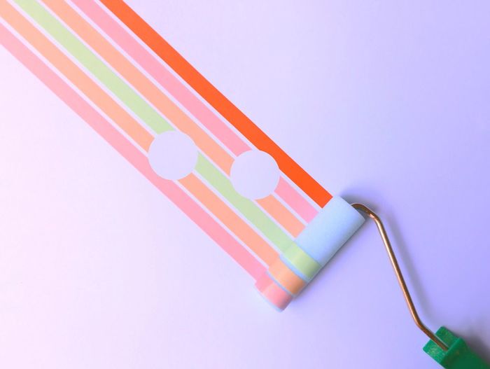 CLOSE-UP OF COLORFUL PENCILS ON WHITE BACKGROUND