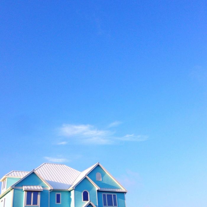 Blue house against blue sky