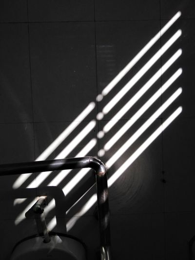 Sunlight falling on wall in public restroom