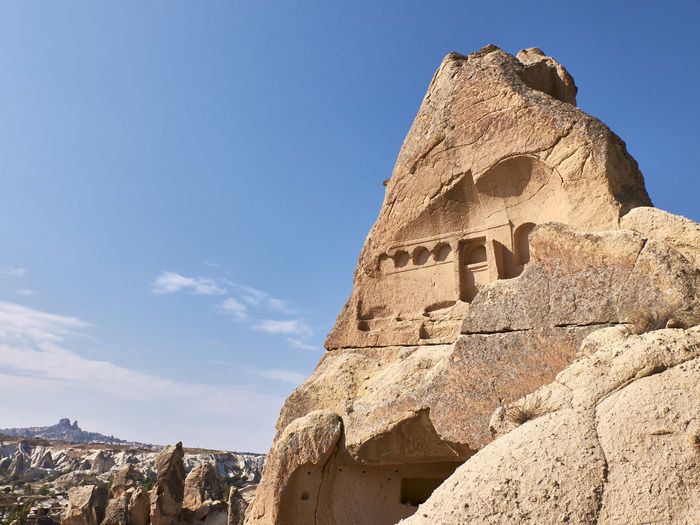 Remains of rock-cut christian temples near goreme, turkey. fairy chimneys in cappadocia