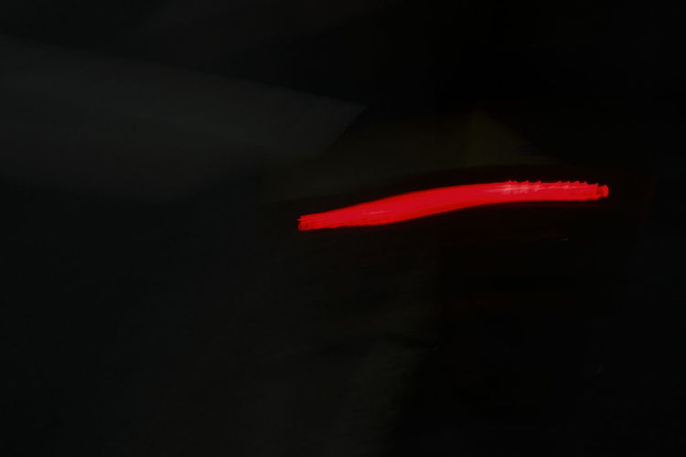 Close-up of red light against black background