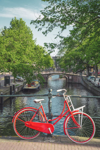 Bicycle parked by river in city