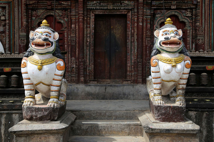 Lion statues at entrance of buddhist temple