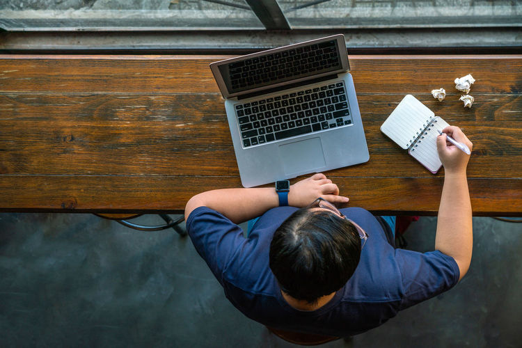 High angle view of woman using laptop
