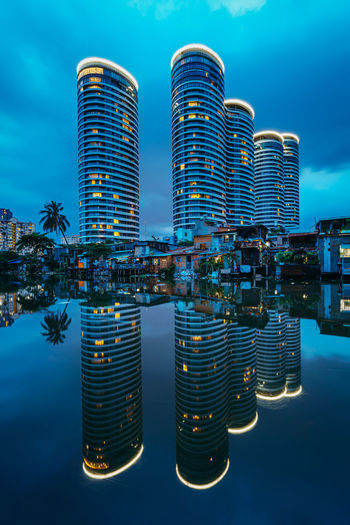 Modern apartment buildings against blue sky