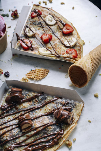 Sweet chocolate crepes on the table. vertical picture