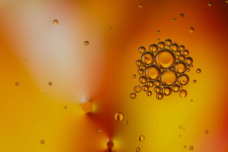 Full frame shot of water drops on orange