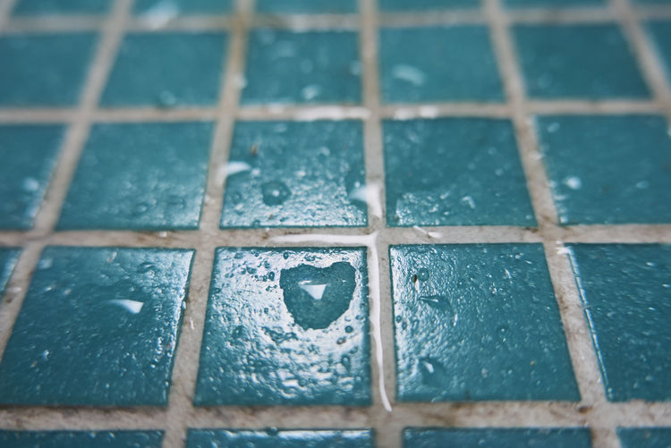 Full frame shot of wet tiled floor